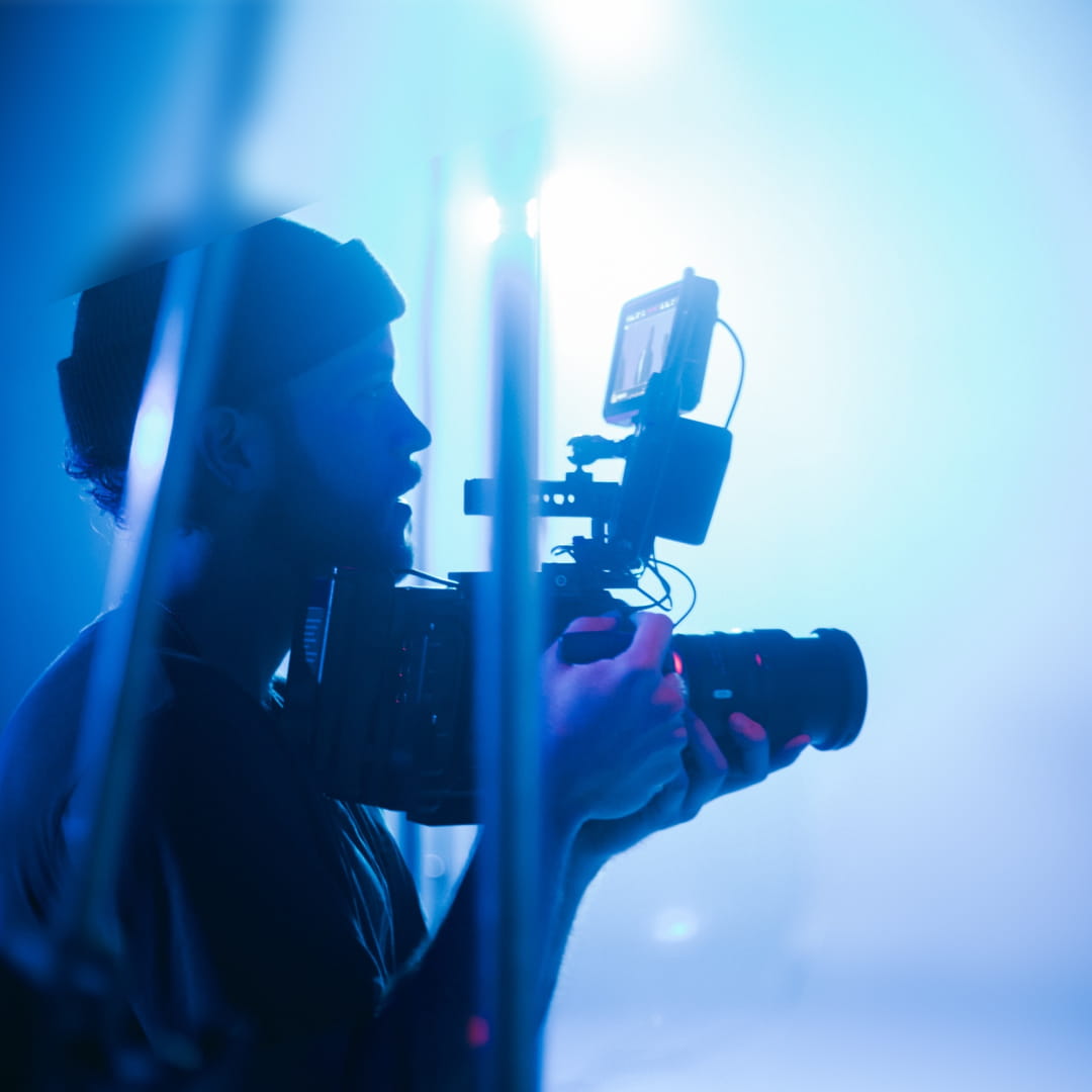 Man holding camera on set